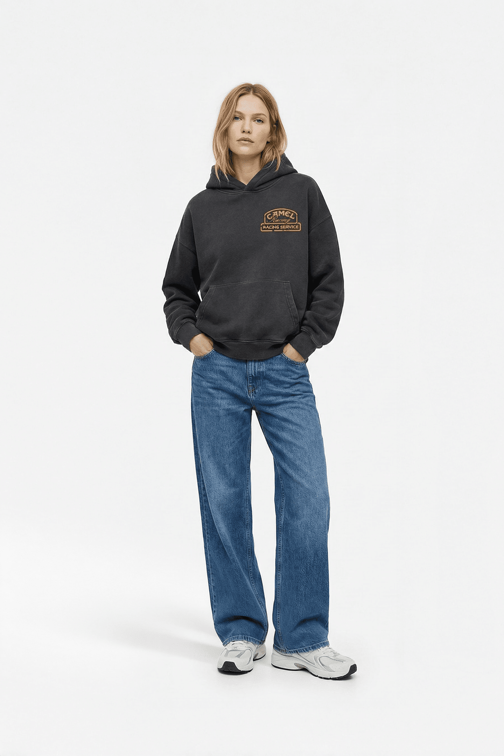 Black racing hoodie with Camel Racing Service logo, styled with wide-leg jeans and sneakers from revnhaus