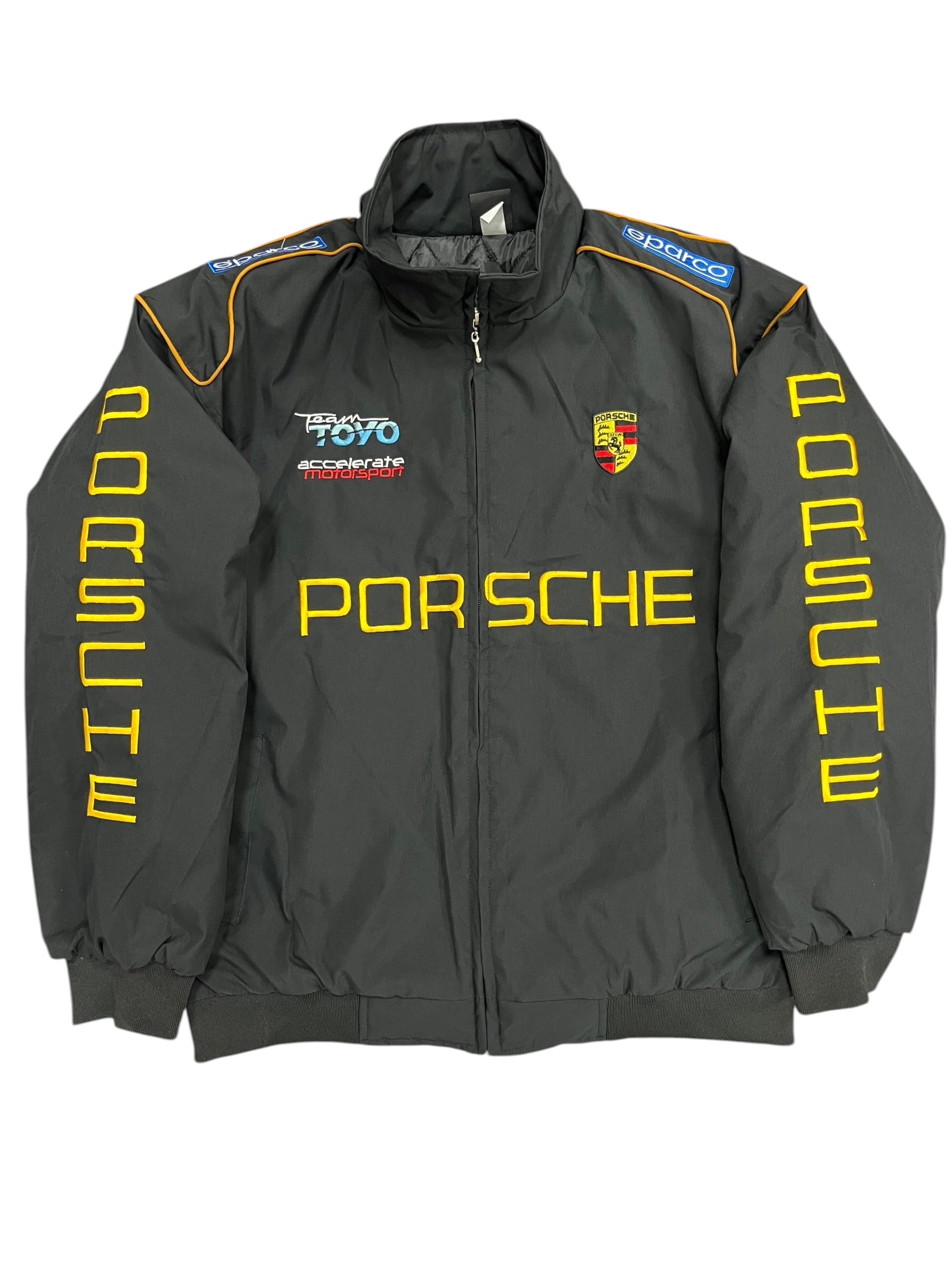Black Porsche motorsport jacket with yellow lettering, Team TOYO logo, and Sparco patches from revnhaus