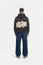 Black motorsport hoodie with Brembo and Alpinestars logos, back view from revnhaus