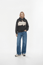 Black Ducati hoodie with flame graphic, worn with blue jeans and sneakers from revnhaus