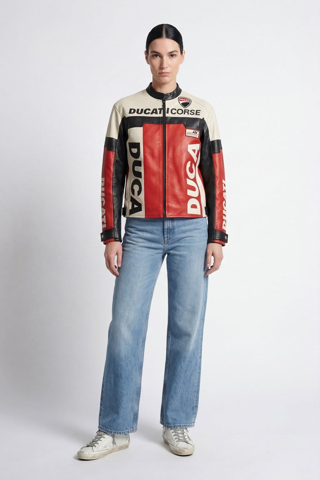 Ducati Corse leather racing jacket with red, black, and cream panels, worn with jeans from revnhaus