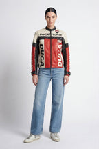 Ducati Corse leather racing jacket with red, black, and cream panels, worn with jeans from revnhaus