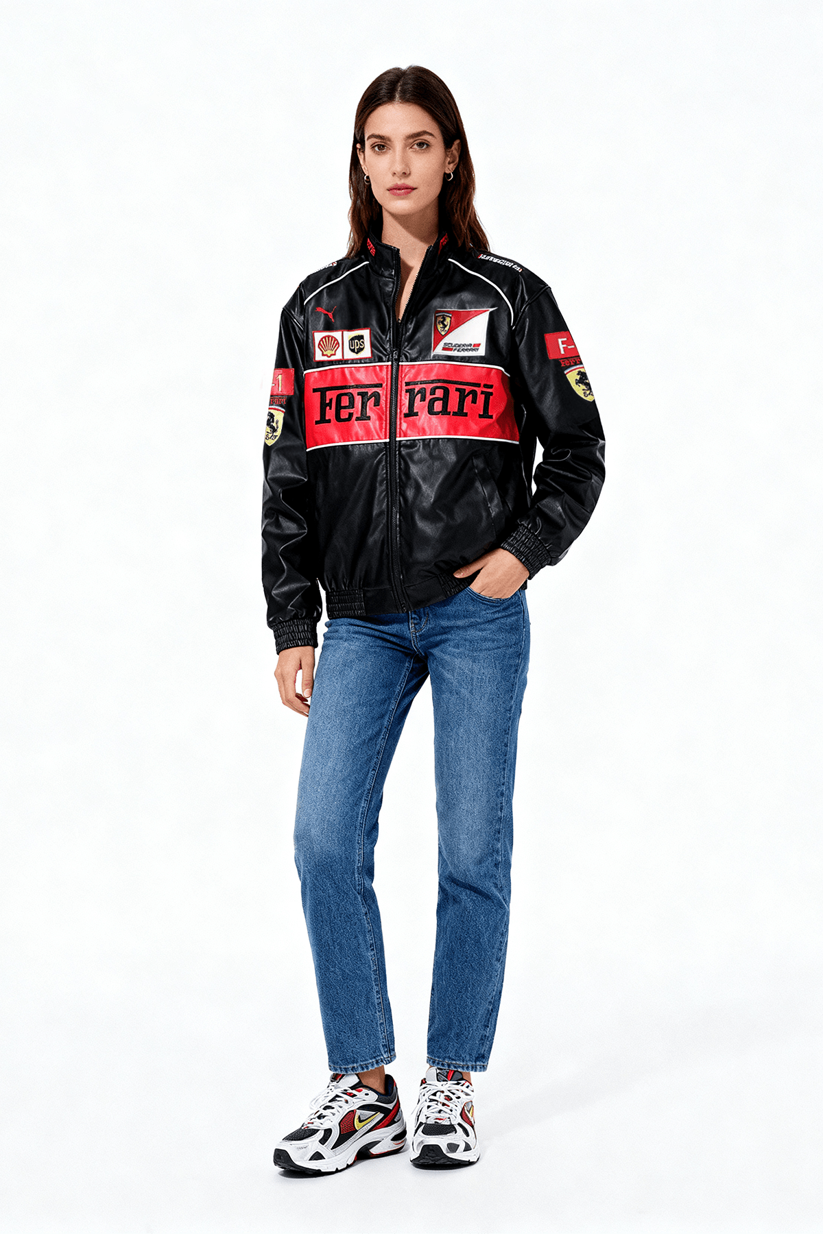 Black Ferrari racing jacket with red accents and sponsor logos, worn with jeans and sneakers from revnhaus