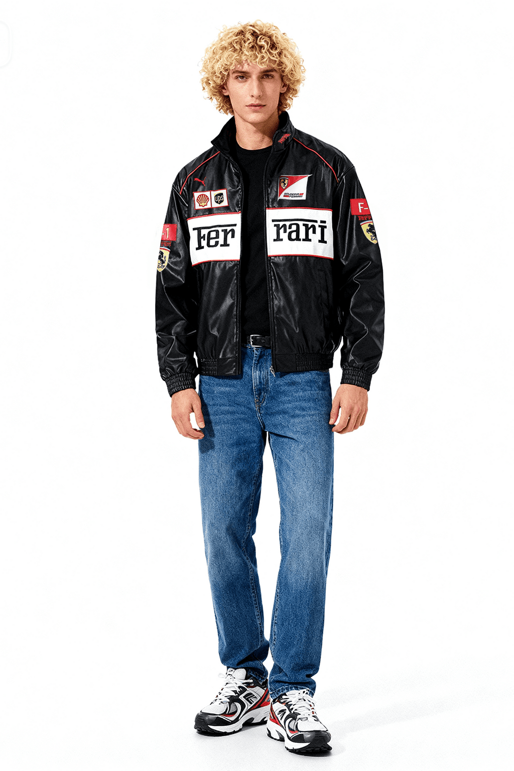 Black Ferrari F1 racing jacket with sponsor patches, worn with jeans and sneakers from revnhaus