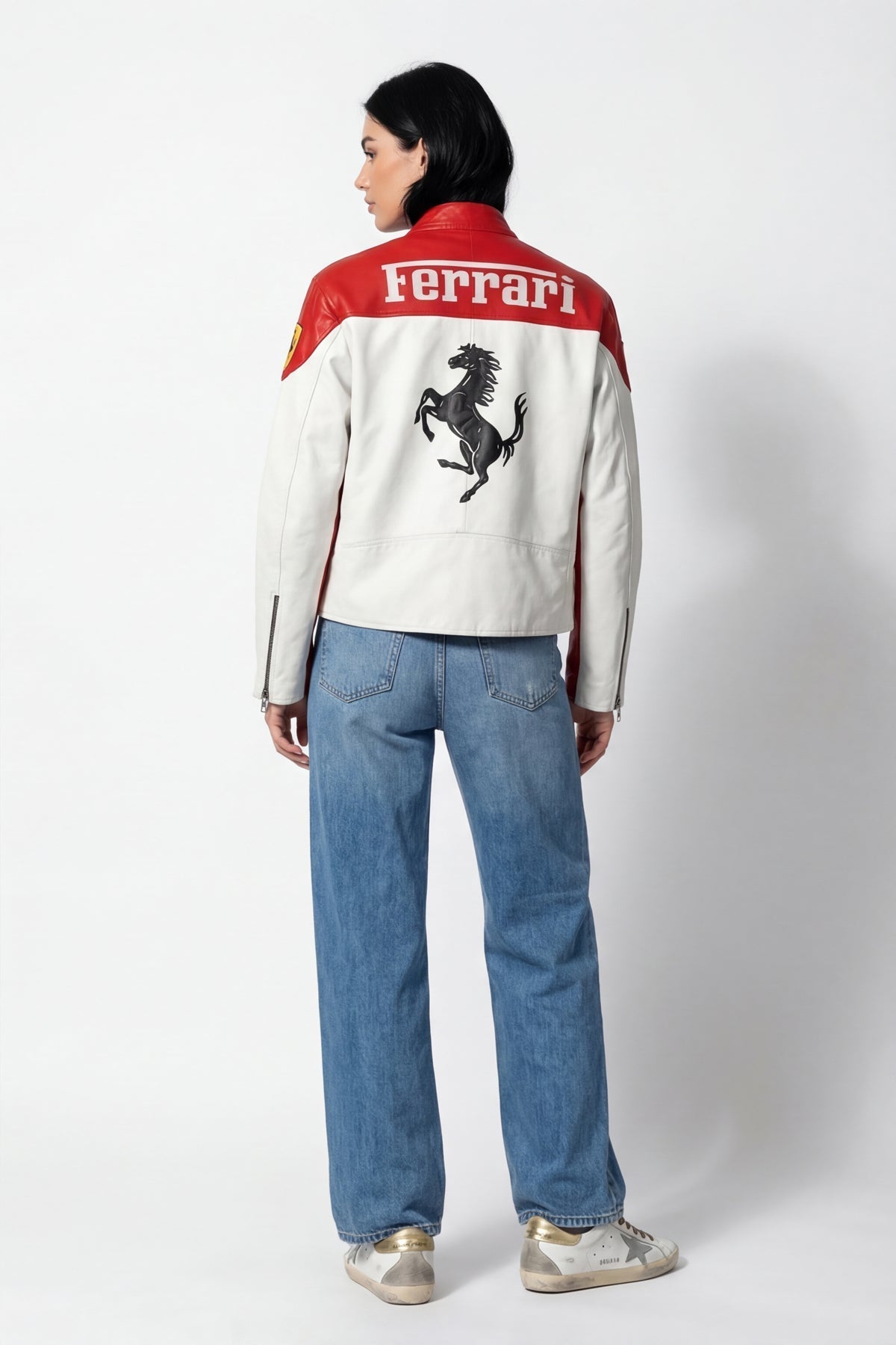 Red and white Ferrari racing jacket with prancing horse logo, worn with jeans from revnhaus