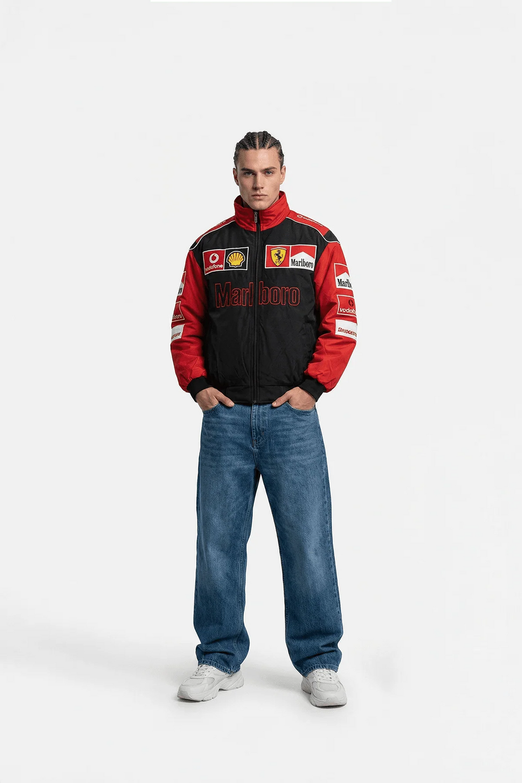 Red and black F1 racing jacket with Marlboro, Ferrari, and Shell logos, worn with jeans from revnhaus