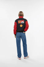 Ferrari F1 racing jacket with Marlboro and Shell logos, worn with jeans from revnhaus