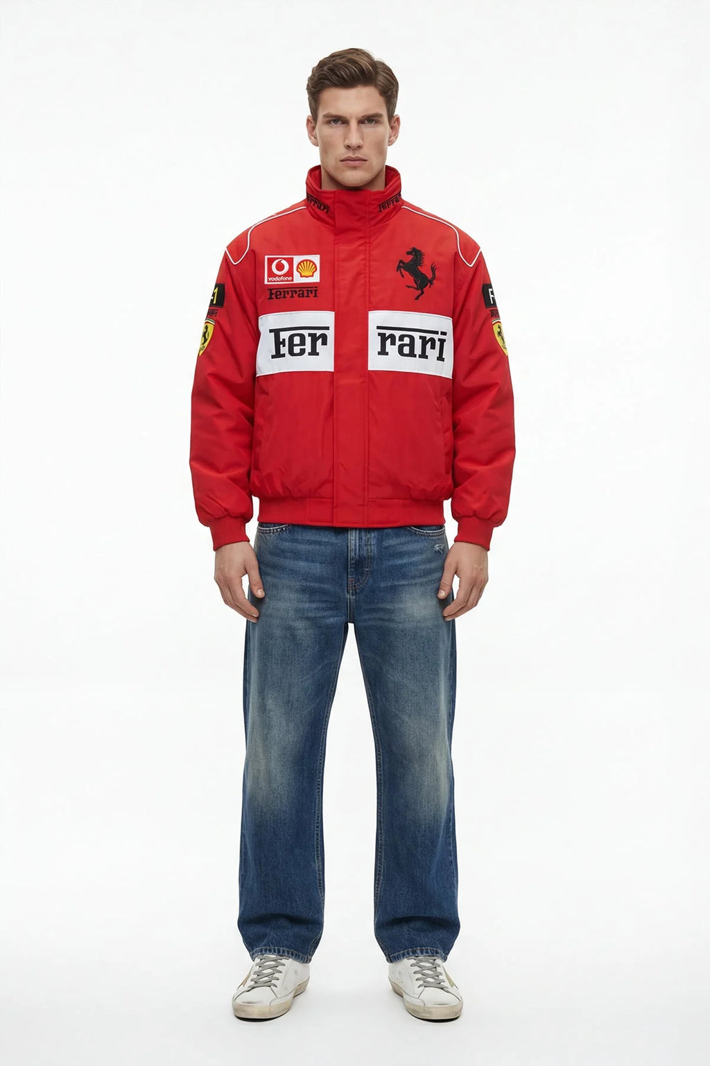 Red Ferrari F1 racing jacket with sponsor logos, worn with jeans and sneakers from revnhaus