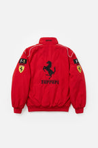 Red Ferrari F1 racing jacket with prancing horse logo and sleeve patches from revnhaus