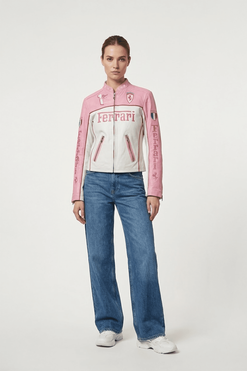 Pink and white Ferrari racing jacket with logo details, styled with jeans and sneakers from revnhaus