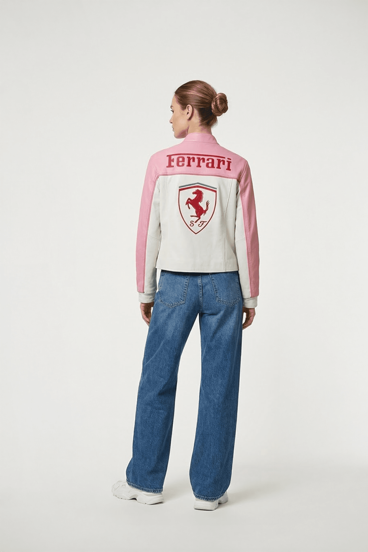 Pink and white Ferrari racing jacket with prancing horse logo, worn with jeans from revnhaus