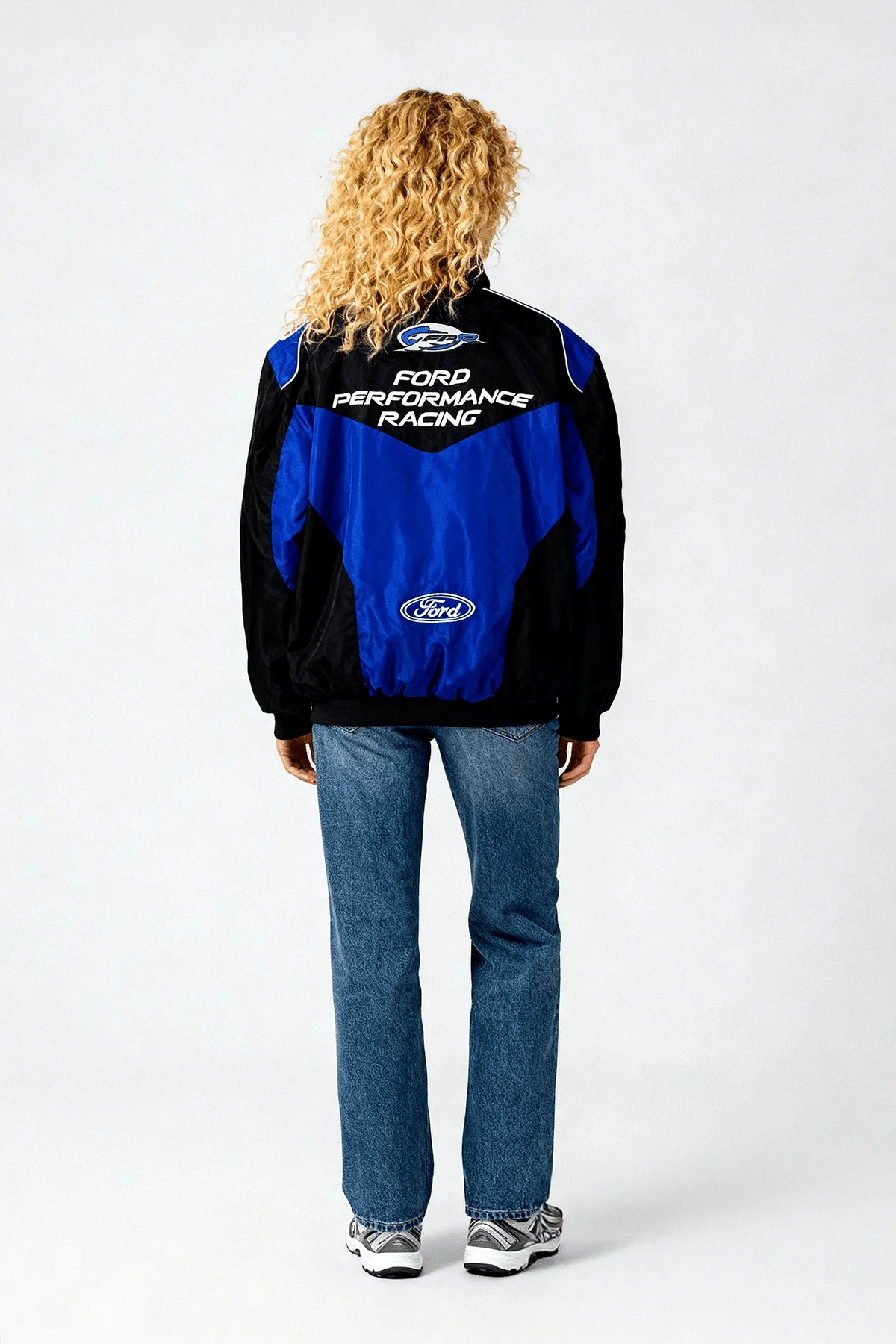 Ford Performance Racing jacket in blue and black, worn by model from revnhaus