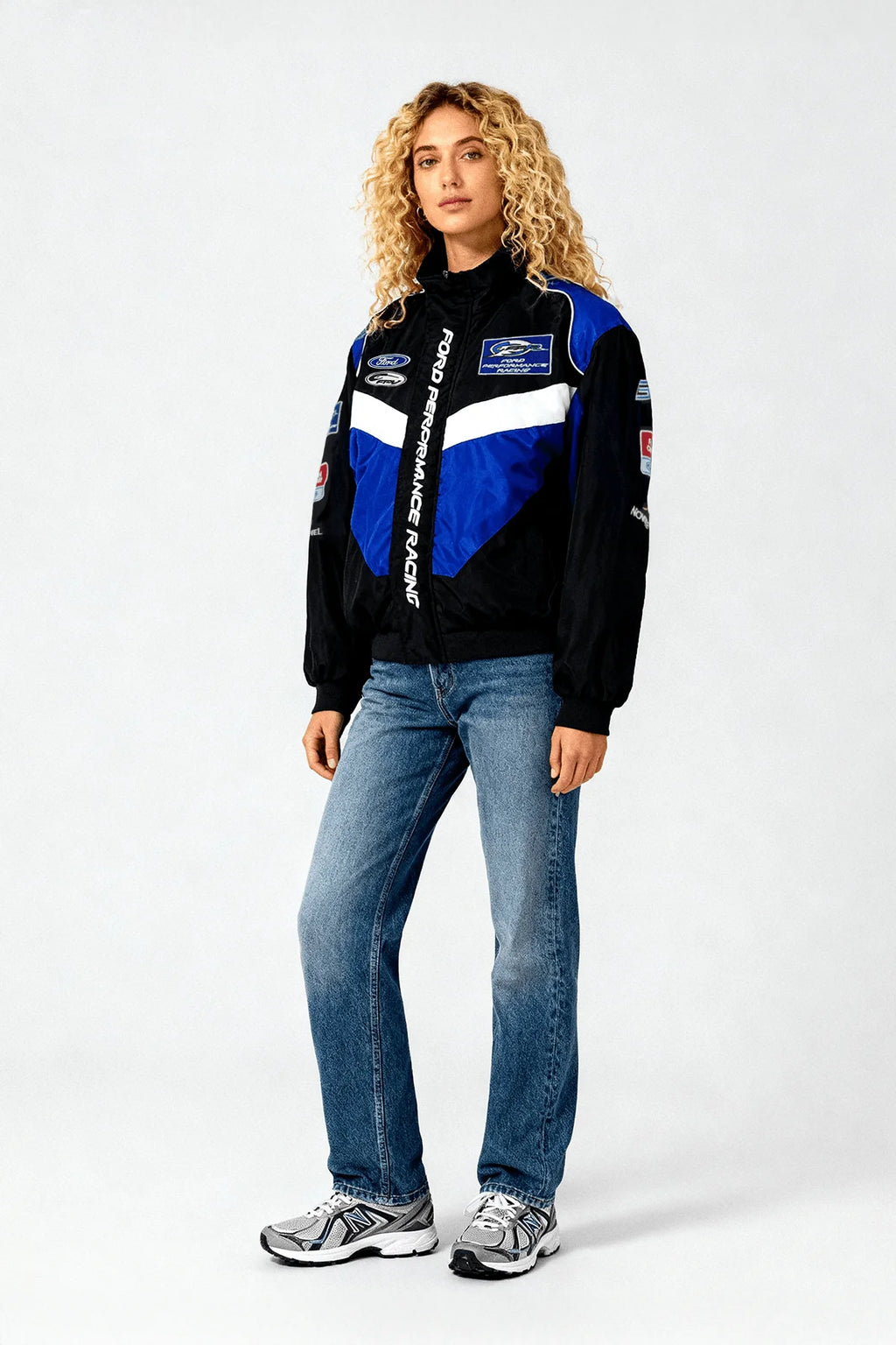 Ford Performance Racing jacket with blue and black design, worn by woman in jeans from revnhaus