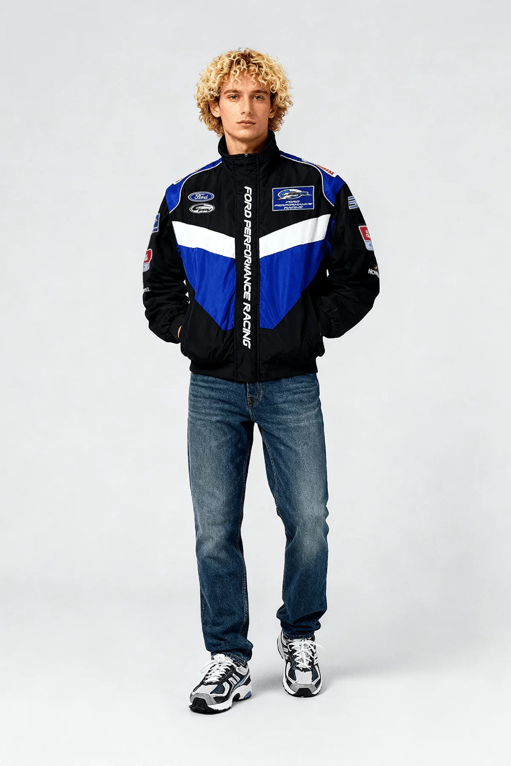 Ford Performance Racing jacket with blue and white accents, worn with jeans and sneakers from revnhaus