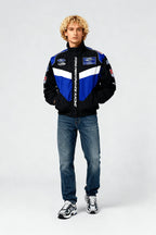 Ford Performance Racing jacket with blue and white accents, worn with jeans and sneakers from revnhaus