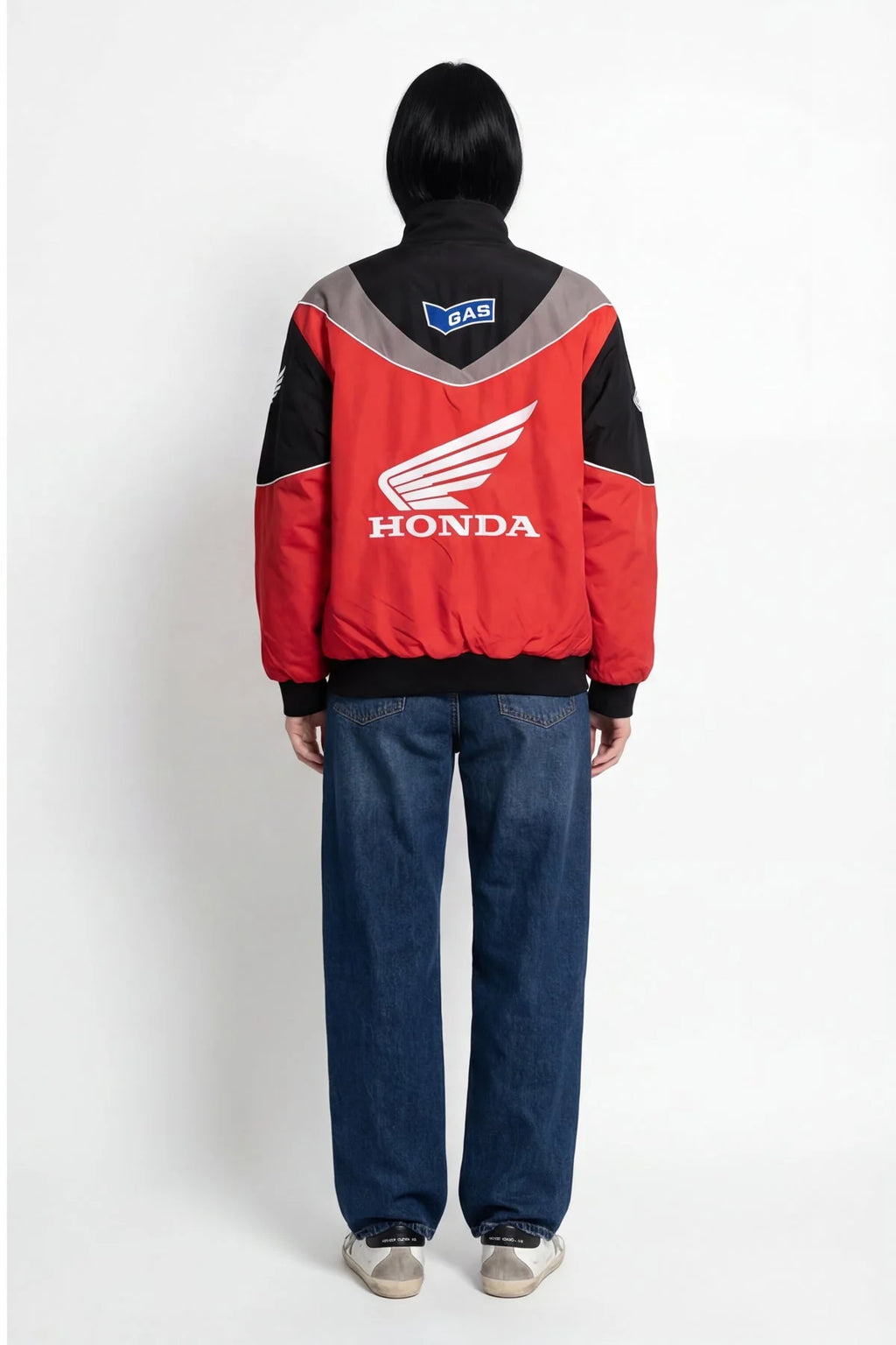 Red Honda racing jacket with white wing logo and GAS patch, worn by model from revnhaus