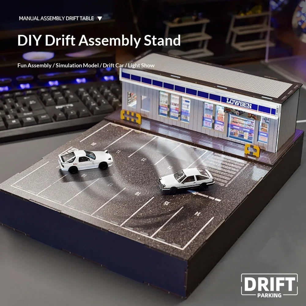 DIY drift assembly stand with miniature parking lot, two drift cars, and Lowben shop model from revnhaus