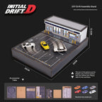 Initial D DIY drift assembly stand with miniature garage and parking lot, includes random small cars from revnhaus