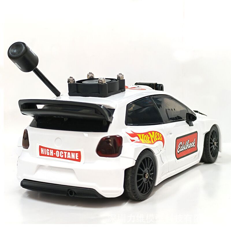 White RC drift car with Hot Wheels and Edelbrock decals, rear spoiler, and exhaust pipe from revnhaus