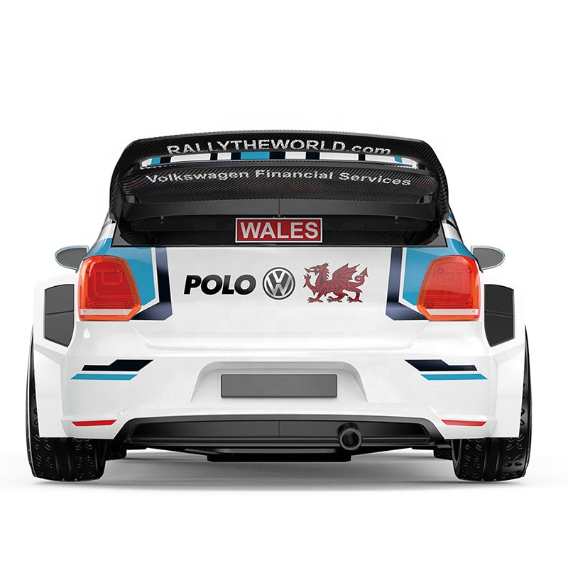 White Volkswagen Polo rally car with Wales dragon decal and carbon wing, from revnhaus