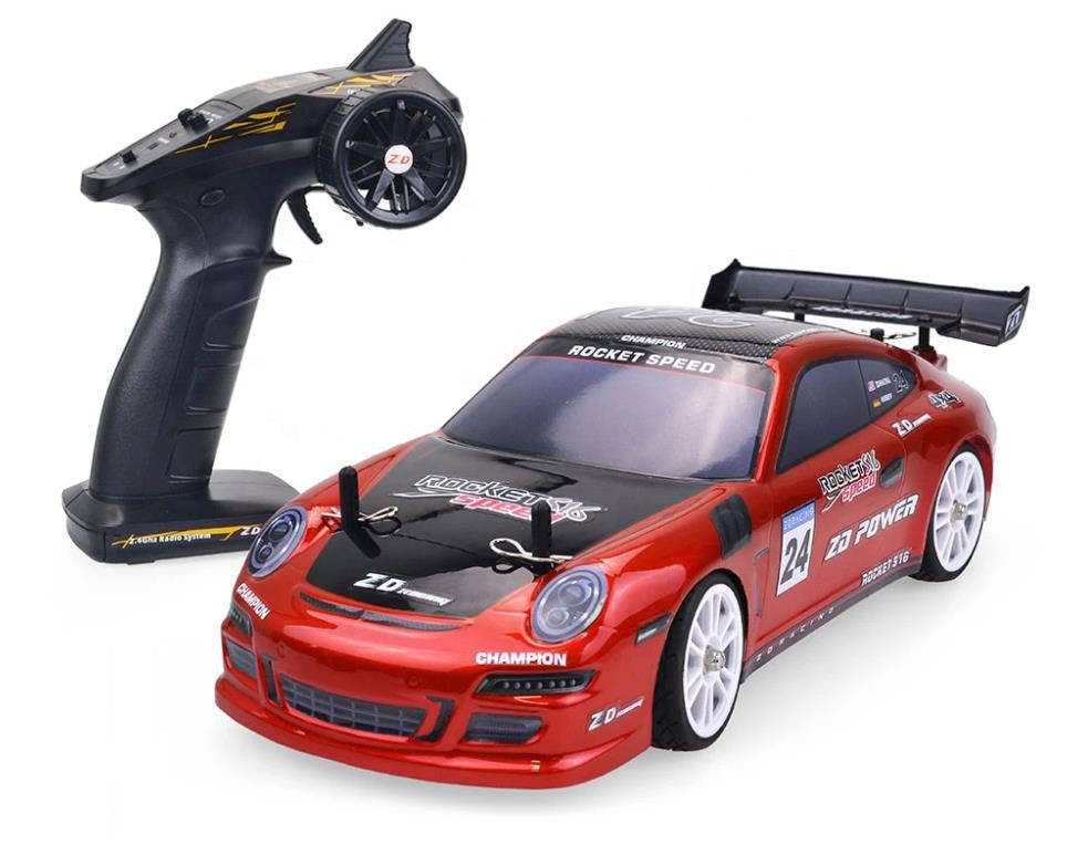 Red RC drift car with remote control, Rocket Speed decals, and racing livery from revnhaus