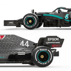 Black Formula 1 race car with Pirelli tires and sponsor logos from revnhaus