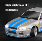 Silver RC drift car with blue racing stripes and high-brightness LED headlights from revnhaus