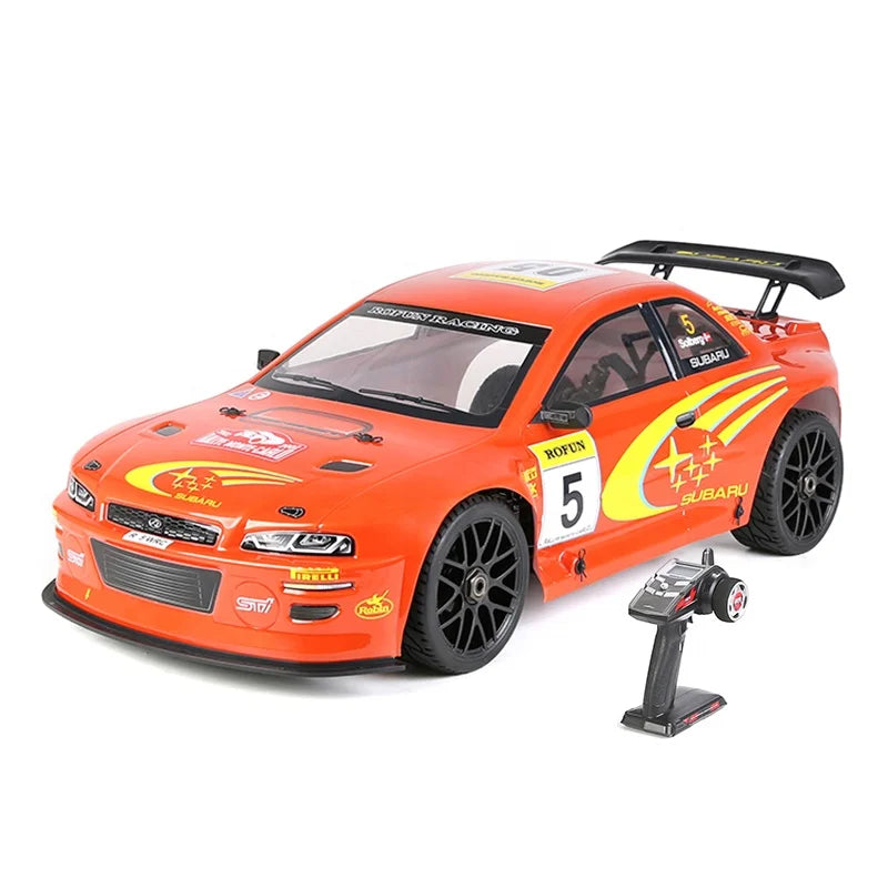 Orange Subaru RC drift car with remote control, race decals, and black wheels from revnhaus