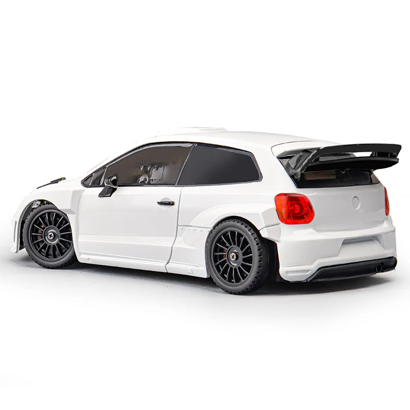 White RC drift car with black rims and rear wing from revnhaus