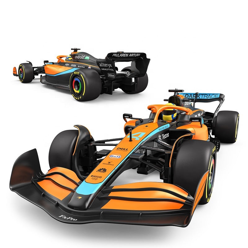 Orange and black Formula 1 race car with sponsor logos from revnhaus