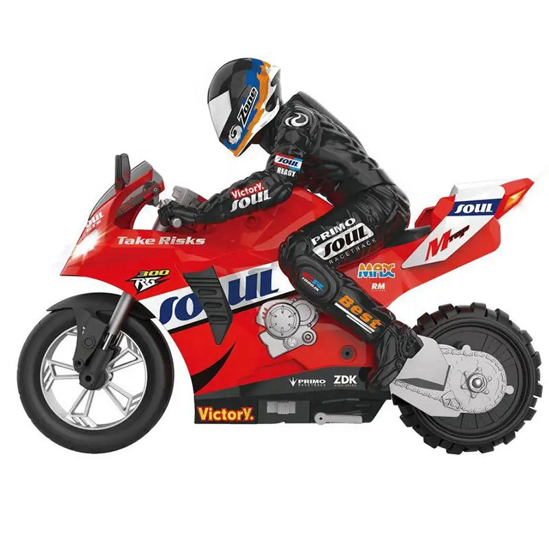 Red RC motorcycle with rider, racing decals, and 'Take Risks' slogan from revnhaus