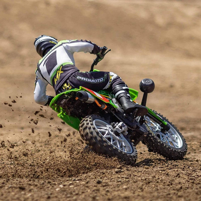 RC drift car racing on dirt track with rider in motocross gear from revnhaus