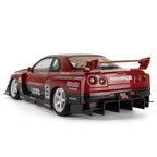 Red Nissan Skyline GT-R die-cast model with Liberty Walk body kit and racing decals from revnhaus