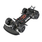 RC drift car chassis with exposed motor and suspension, black tires, red wiring from revnhaus