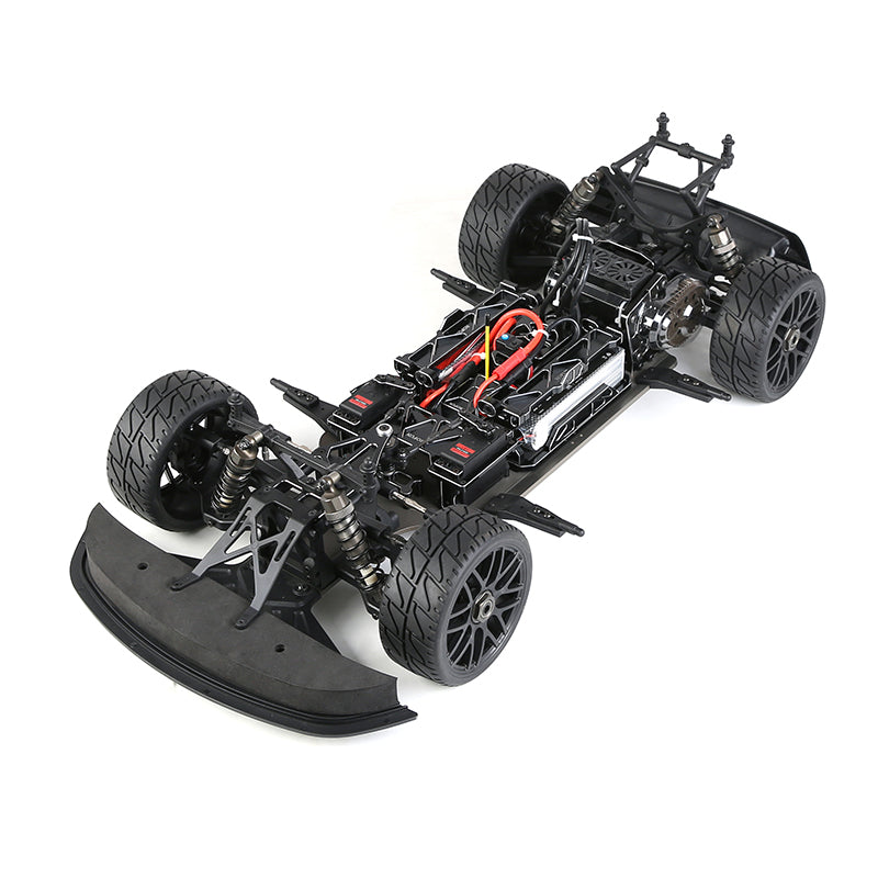 RC drift car chassis with exposed motor and suspension, black tires, red wiring from revnhaus
