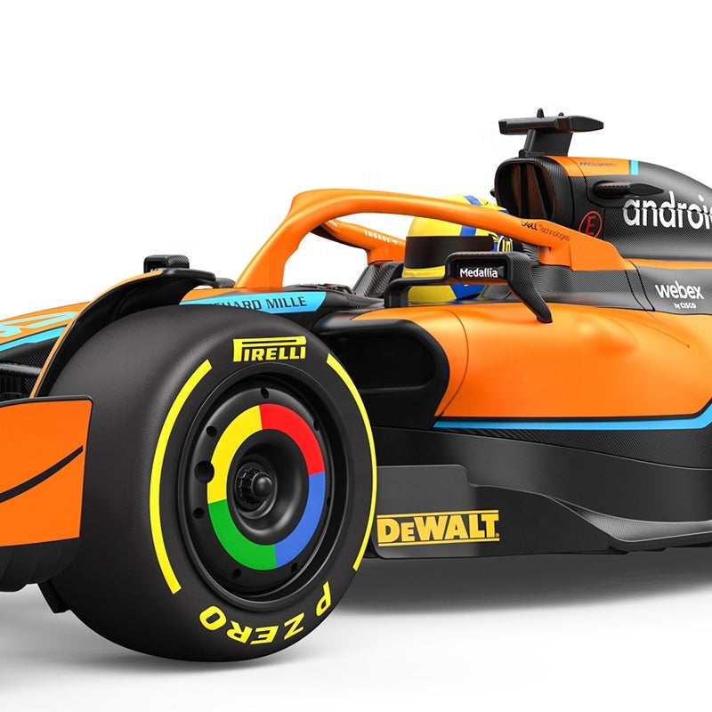 Orange and black Formula 1 race car with Pirelli P Zero tires and DeWalt branding from revnhaus