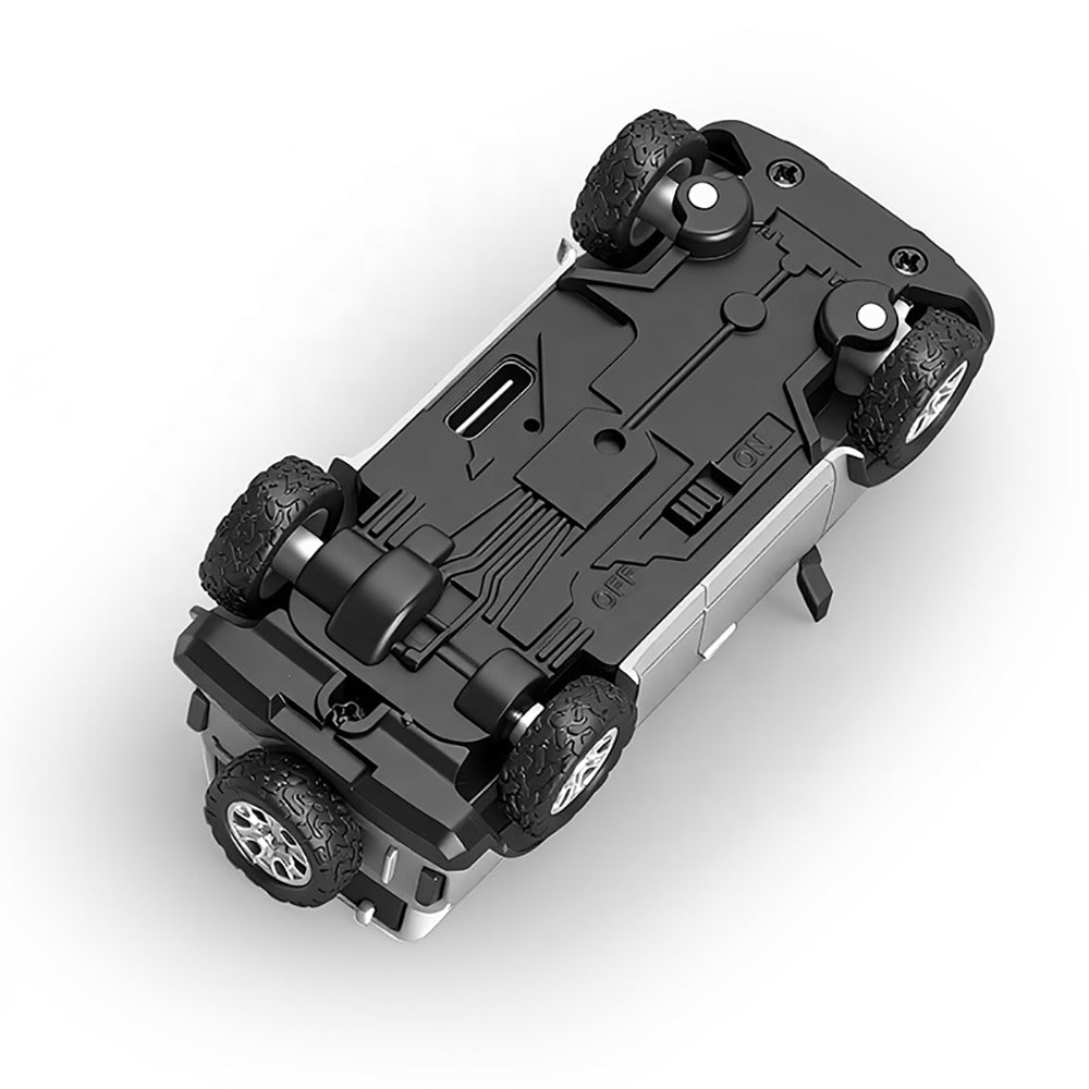 RC drift car underside with rugged tires and on/off switch from revnhaus