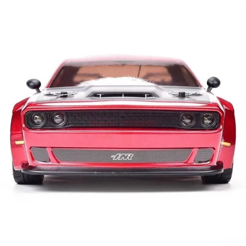 Red RC drift car with black grille and HR badge, front view from revnhaus
