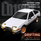 White AE86 remote-controlled drifting car with gold rims, headlights on, from revnhaus