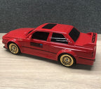 Red die-cast drift car with gold wheels and ORIGIN decals from revnhaus