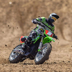 RC drift bike racing on dirt track with rider in green gear from revnhaus