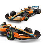 Orange and black Formula 1 race car with Pirelli tires from revnhaus