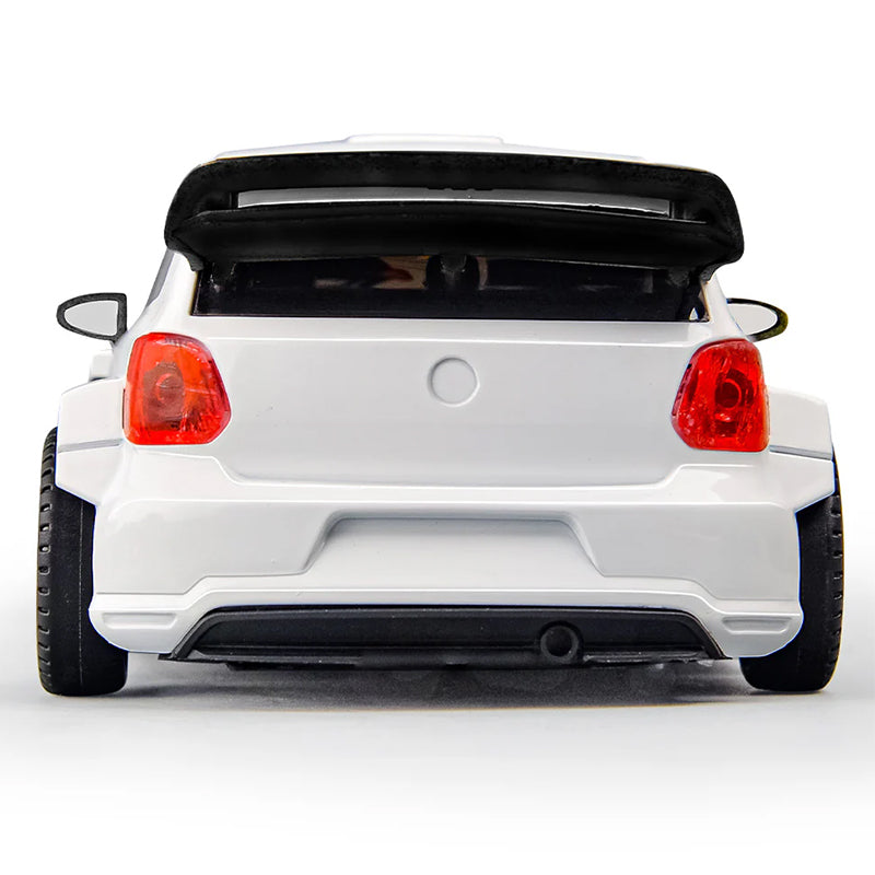 White die-cast rally car with black spoiler and red taillights from revnhaus