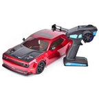 Red RC drift car with black hood and remote control from revnhaus
