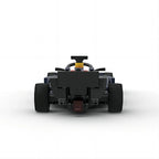 Black LEGO-style F1 race car with rear wing and wide tires from revnhaus