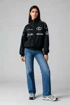 Black Lexus racing jacket with white logos, styled with jeans and sneakers from revnhaus