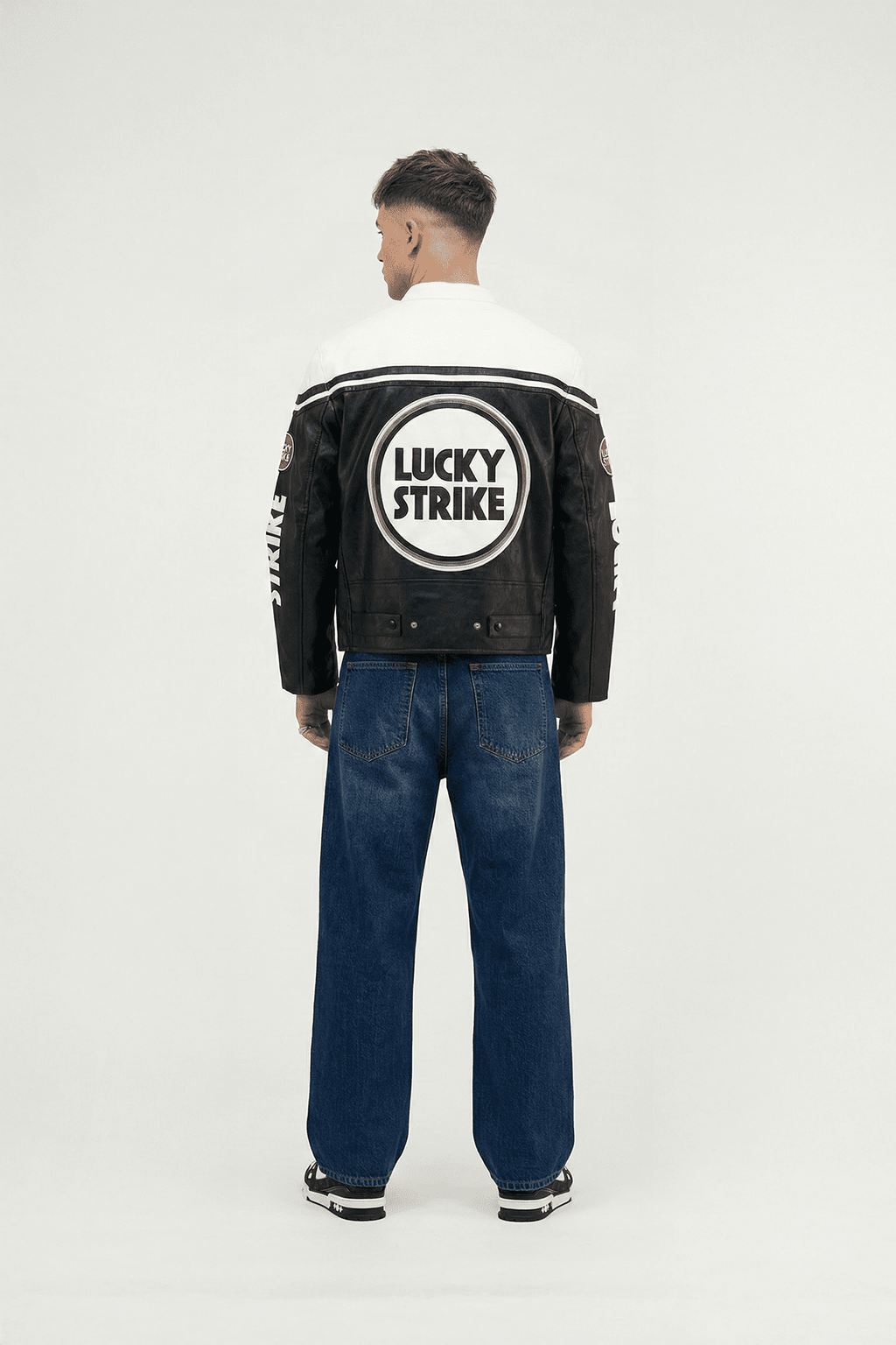 Black and white Lucky Strike racing jacket with bold logo back view from revnhaus