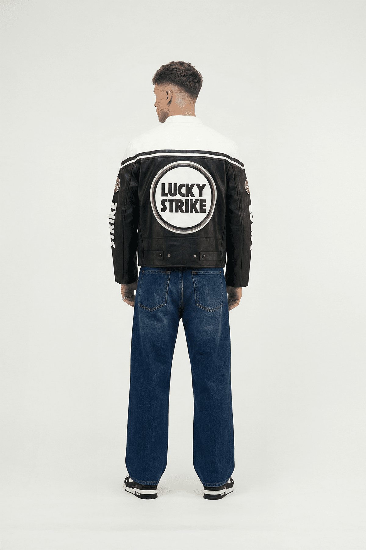 Black and white Lucky Strike racing jacket with bold logo back view from revnhaus