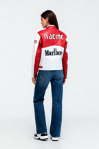 Red and white racing jacket with Marlboro logo, worn with jeans from revnhaus