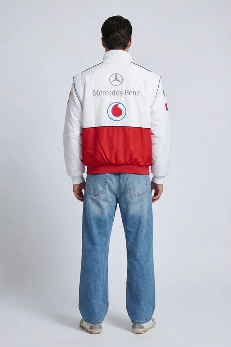 White and red Mercedes-Benz racing jacket with Vodafone logo, worn with blue jeans from revnhaus